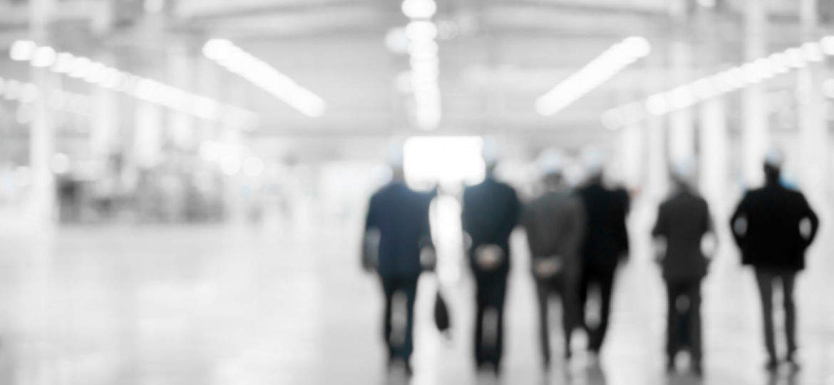 group of men wearing hardhats, walking