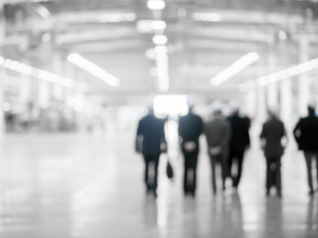 group of men wearing hardhats, walking