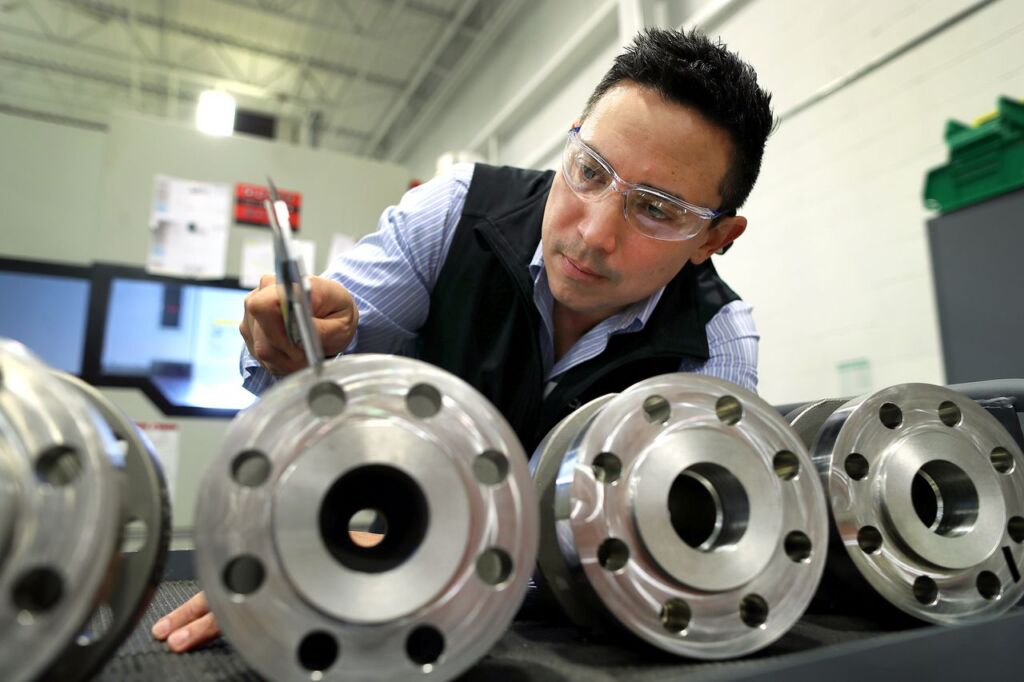 Kyle Daniels, CEO of Clarke Valve, used a caliper to check the custom dimensions requirements of the Dilating Disk™ Valve.